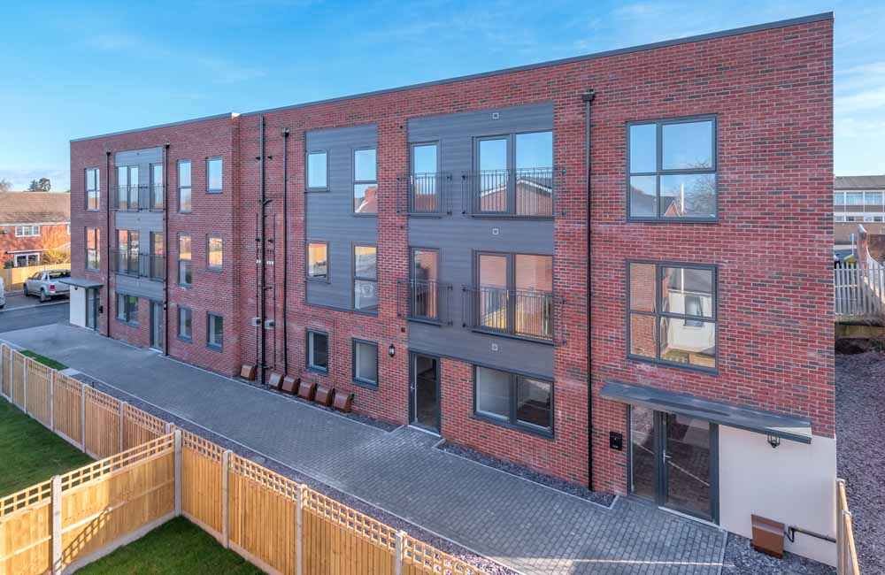 Red brick apartment building by TC Homes, Shrewsbury, Shropshire