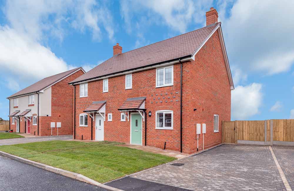 Red brick semi-detached house by TC Homes